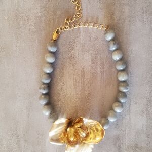Elegant Gold and Gray Necklace with Floral Pendant